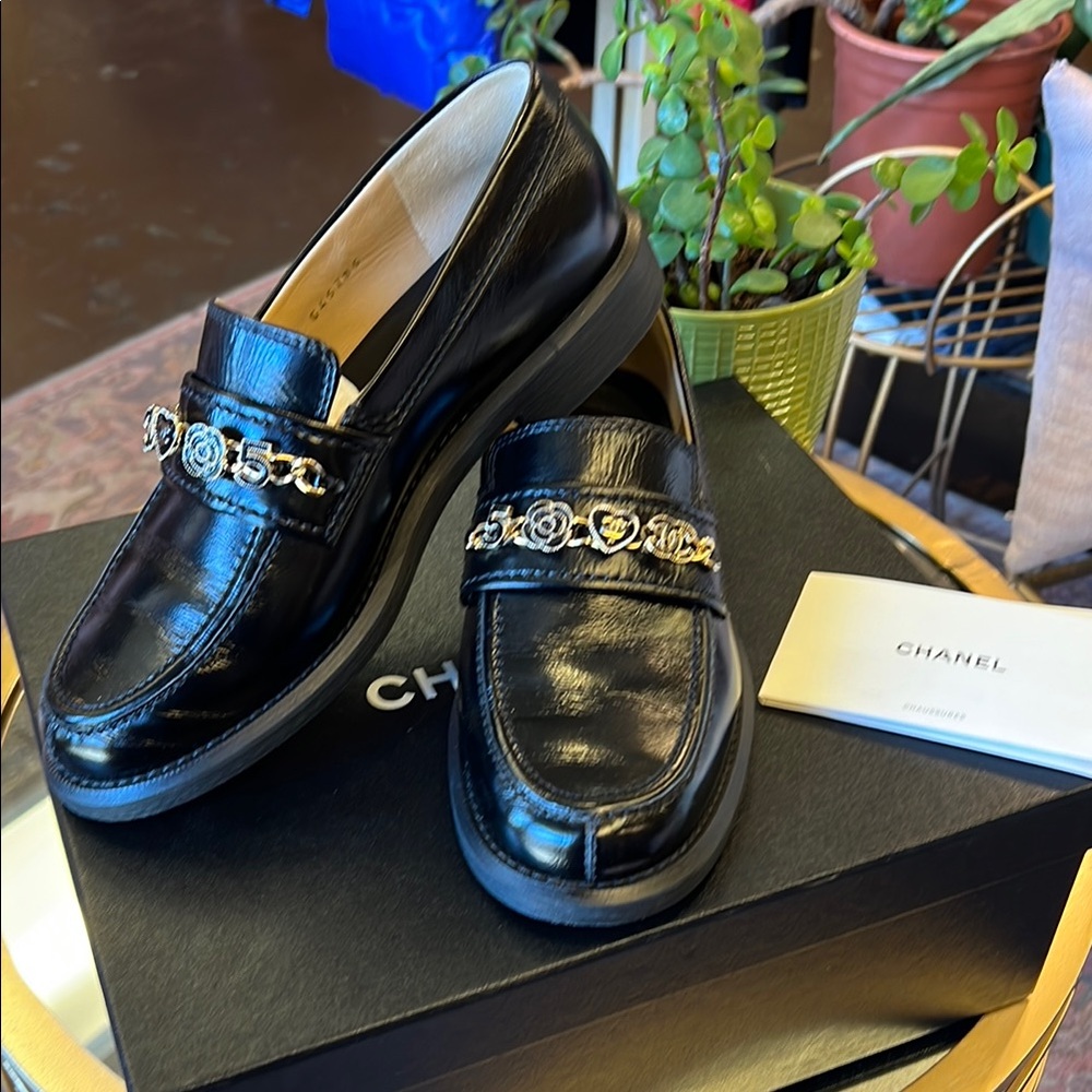 CHANEL Black and Gold Leather Loafers with Chain Accent